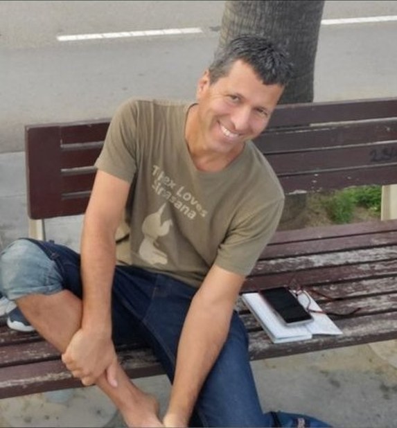 Kevin Coca sitting on a bench